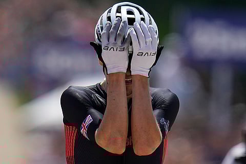 Thomas Pidcock celebrates winning men's mountain bike race